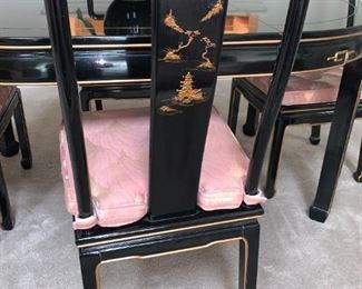 Black Lacquer Oriental Dining Table Set 6 chairs (2 with arms - see other pics), 2 leaves and table pads. Hand painted design, removable cushions. Excellent condition. See all pics. Table Dimensions: 62" wide (no leaves) by 42” deep by 31” tall, 2-leaves- 20 x 42" each, makes table 82" or 102" w if desired.