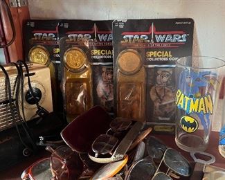 A few unopened Star Wars figures & some sweet Batman drinking glasses.