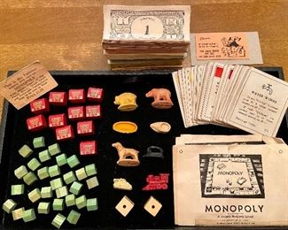 1935-36 WWII Monopoly Game with Bakelite tokens and dice; Grand Hotel wooden hotels and houses, game board, cards and instructions 