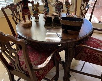 handsome small carved table with 4 chairs