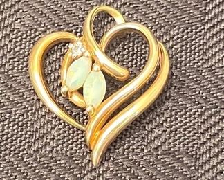 30-PEZ1- $75 
10Kt gold heart with 2 opals 3.22 gram 1"L