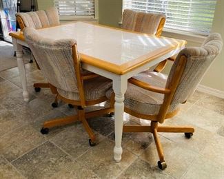 55____$195
Kitchen table & 4 chairs on casters
table weight  • 30high 54wide 36deep 
rolling chairs  • 36high 25wide 26deep