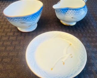 18_____ $75 
Made in Denmark set of 8 pieces blue with birds 