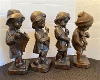 63 - $150 German carved set of 4 children 15"H x 5"base 
