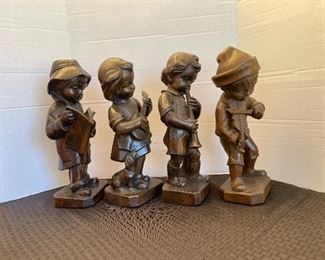 63 - $150 German carved set of 4 children 15"H x 5"base 
