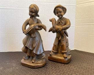 65_____ $40 
Pair of children wood carved 