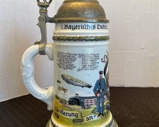 67_____ $50 
Set of 3 Steins porcelain with pewter accents 