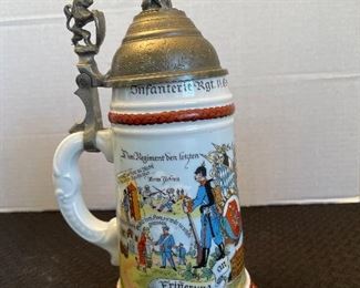 67_____ $50 
Set of 3 Steins porcelain with pewter accents 