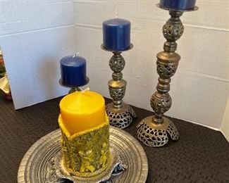 108_____ $50 
3 brass candleholders & 1 pewter gothic from France + 1 candle 