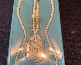 127_____ $30 
 Bone necklace in original box