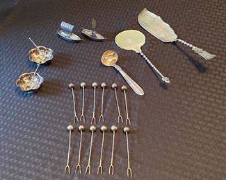 114 - $80 Lot of Sterling salt cellars with spoons, 2 chinese boat salt & pepper, 12 apetizer forks, danish spoon and two pastry serving pieces. 