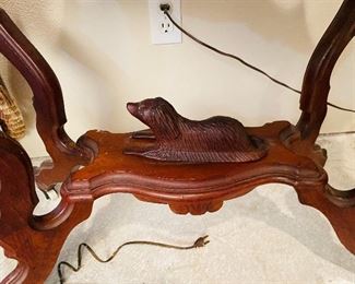 #27 - $450 - Circa 1860's walnut turtle top table, original marble tops, ogee edging, with reclining dog on base. • 28high 36wide 22deep 