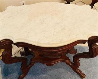 86B - $495 - Another one, slightly different Circa 1860's walnut turtle top table, original marble tops, ogee edging, with reclining dog on base. • 29high 31across 20deep 