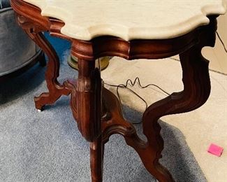 86B - $495 - Another one, slightly different Circa 1860's walnut turtle top table, original marble tops, ogee edging, with reclining dog on base. • 29high 31across 20deep 