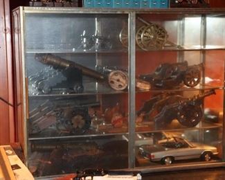 cannons, cars, display case