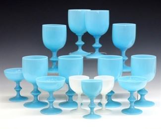 Fourteen mid 20th century French Portieux Vallerysthal opaline glasses.  Includes eight Blue water goblets, three Blue sherbet/champagne glasses, one White and two Blue sherry glasses.  Sherry glasses with "P.V. France" stickers.  Slight surface wear, some with minor edge roughness.  4 1/4  to 6 1/2" high.  ESTIMATE $300-500
