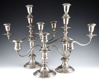 Three Sterling Silver convertible candelabra with two arms and weighted bases.  Includes a four-part Towle pair, and a two-part Gorham.  Impressed marks.  Some wear and minor damage, dents to bases.  7 3/4 to 13 1/2" high.  ESTIMATE $200-300
