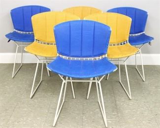 Six mid 20th century Harry Bertoia for Knoll side chairs.  White vinyl coated Steel frames, with Mustard and Blue vinyl slipcover cushions.  Original Knoll label and sticker under seat cushions.  Minor wear to frames, cushions worn with some splitting, fading, and staining.  Each 21 x 18 x 30" high overall.  ESTIMATE $600-800
