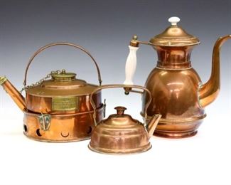 Three 19th century Copper items.  Includes a "Sirram" picnic teapot with burner, a coffee pot with porcelain handle and finial, and a small teapot with Brass fittings.  Some surface wear, discoloration and denting.  5 to 9 1/2" high.  ESTIMATE $100-200
