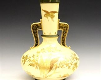 A late 19th century Gustave Demartial & Co. Limoges porcelain vase.  Bulbous form with long tapered neck and two handles in Cream and Green, decorated with Gold floral and crane design. Stamped "G.D. & Co", "L" and "Depose".  Minor wear to surface and decoration.  9" diameter x 12 1/2" high overall.  ESTIMATE $100-200
