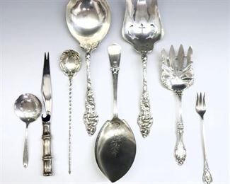Eight Sterling Silver specialty serving utensils.  Includes a serving spoon and fork set, meat fork, pickle fork, fish server, two strainer spoons and a Tiffany & Co. "Bamboo" pattern bar knife.  Each impressed "Sterling".  14.73 total troy ozs plus 1 hollow handle, approximately 15.23 total weight.  Minor wear.  4 3/4 to 9 1/2" long.  ESTIMATE $300-500
