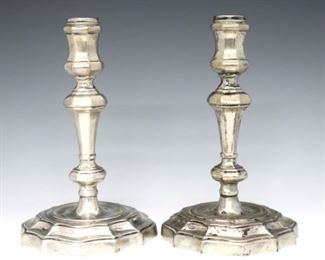 A pair of Italian Silver candlesticks.  Baluster form with scalloped molded bases.  Impressed "800" and "283FI".  13.91 troy ozs total weight.   Some wear and discoloration.  7 1/2" high.  ESTIMATE $300-400
