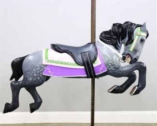 A turn of the century American Carousel horse by Allan Herschel, North Tonawanda, NY.  Carved wooden body with a flowing mane and shaped saddle.  Re-painted Dapple Gray finish with jeweled detail.  Some older repair and added decoration.  48" long.  ESTIMATE $800-1,200
