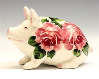 A late 20th century Exon Pottery Wemyss Ware pig by Brian Adams.  Decorated with a bumblebee and "Cabbage Rose" pattern.  Painted and impressed marks.  Minor surface wear, some crazing.  Approximately 4 1/2 x 2 x 3" high overall.  ESTIMATE $200-400
