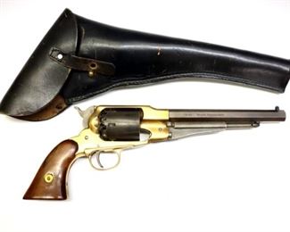 An Uberti replica 1858 Remington black powder revolver.  .44 caliber, 6 shot, rifled 7 3/4" octagonal barrel, with a walnut grip and Brass frame.  Impressed "Made in Italy" with "Cal. 44" and "Black Powder Only" on barrel.  Some wear overall, Brass frame cleaned with light scratches, slight pitting to barrel and frame, small rust spot to side of barrel, mechanism functions.  13 1/2" long.  ESTIMATE $100-200

