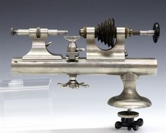 A turn of the century American Watch-Tool Co. jeweler's lathe.  Impressed serial #22453 with maker's name and "Webster-Whitcomb, Hard".  Some surface wear and oxidation.  11" long.  ESTIMATE $200-300