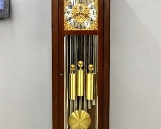A 1960's Herschede #217 "Whittier" Model grandfather clock.  8-day weight driven movement with Westminster, Whittington and Canterbury Cathedral striking on 9 tubes, a Silvered dial with Arabic numerals, painted moon phase and pierced Gilded Brass spandrels, subsidiary seconds, Strike/Silent and Chime select dials.  Mahogany case with molded broken arch top and turned finial over a single long door flanked by reeded pilasters on a stepped, molded base.  Original finish with minor wear, running and striking correctly when cataloged.  80 1/2" high.  ESTIMATE $800-1,200