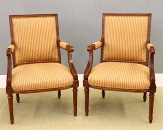 A pair of Hancock & Moore "Bristol" model armchairs.  Square molded backs with shaped arms and carved acanthus leaf detail on turned fluted legs. Original "Antiqued" painted Mahogany tone finish.  Very good condition.  Each 25 1/2 x 23 x 37" high overall.  ESTIMATE $400-600