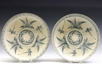 A pair of Chinese Blue and White porcelain plates.  Hand-painted dragonfly and foliate decoration with Iron glazed rim.  Surface wear and scratches, crazing, some marks and discoloration.  Each 10 1/4" diameter.  ESTIMATE $200-300
