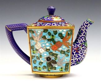 A Chinese Cloisonne teapot.  Square form with multicolor Koi fish decoration and Gilded detail.  Slight surface wear, minor loss to decoration.  6" high.  ESTIMATE $200-400