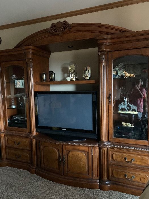 Beautiful Entertaining Center with adjustable bridge to accommodate larger televisions