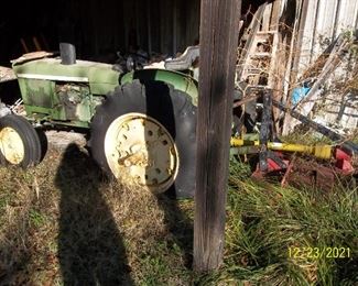 John Deere tractor and bushhog attached