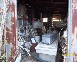 old wooden windows in this room, small wooden shutters, misc tools