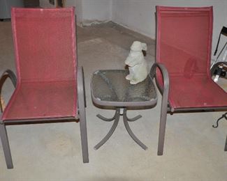 Outdoor 3 Piece Sitting Area Shown with a Concrete Bunny Sculpture