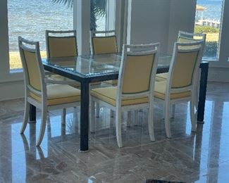 16- NOW $300 WAS $695 Metal and wood rectangular dining tables with 6 white wood painted chairs with yellow upholstery. table 
• 29high 68wide 44deep 
chairs • 39high 21wide 22deep