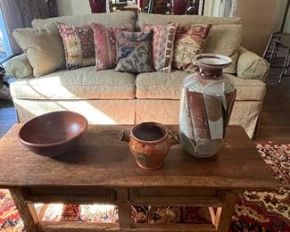 This sofa is new!  Antique custom made rug pillows.  Pottery from all over the U.S.