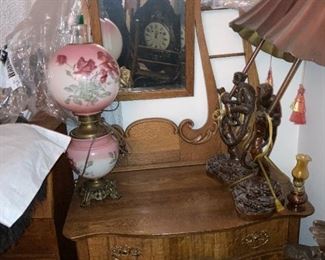 . . . . a nice early 1900's oak commode with Gone With the Wind style lamp
