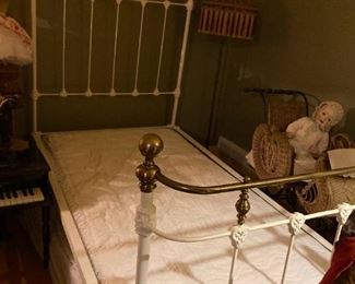 . . .  . a child's vintage wrought-iron and brass bed