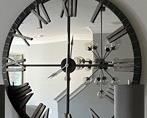 PRICE - $750; Exquisite Living's mirrored, battery-operated wall clock; diameter is 60".