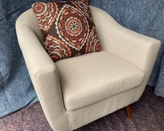 PRICE - $450/each; Pair beige upholstered tub chairs on wooden legs.