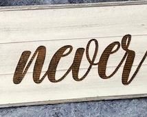 PRICE - $150; 'love never fails' sign.