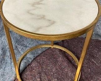 PRICE - $550; gold circular side table with marble top.