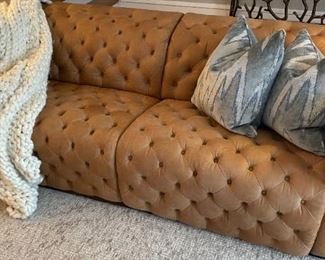 PRICE - $3,500; Exquisite Living Italian tufted leather sofa that reclines in both sections. PRICE - $1,050; Exquisite Living square marble coffee table. Both in excellent condition.