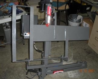 Lift just slides into 2 inch receiver hitch, Plugs into trailer lights and ready to go.  