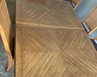 Inlaid dining room table and 6 cane chairs in great shape