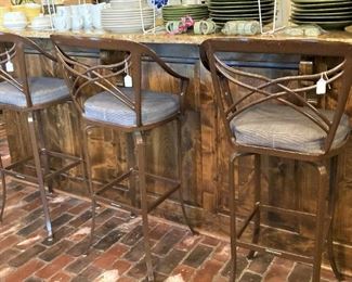 Three of the four matching bar stools